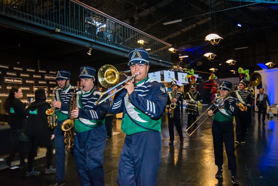 Marching band parading the expo floor.