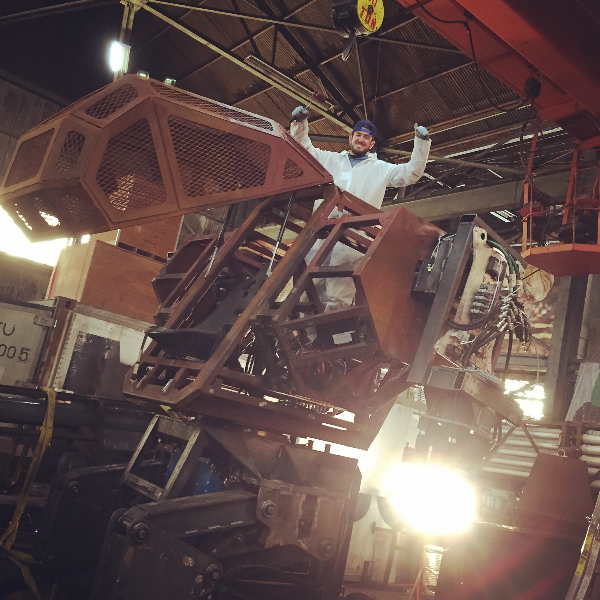 Crewman atop the Mark II frame during shop build.