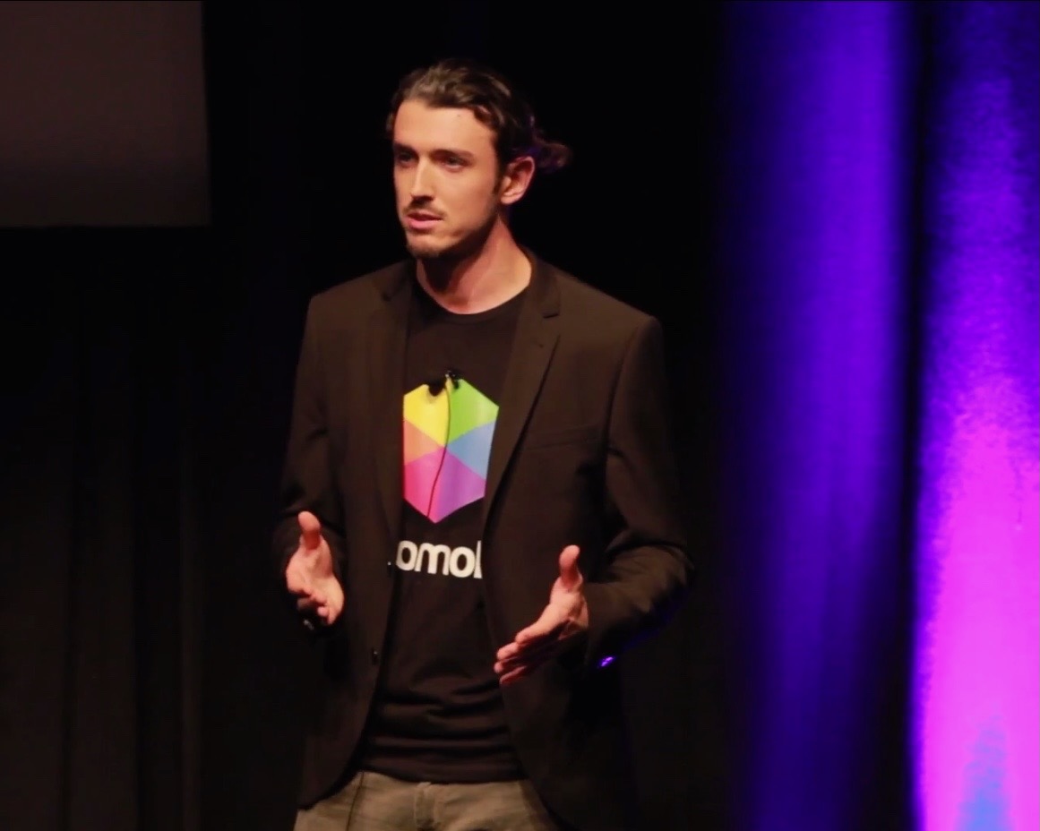 Brinkley Warren speaking on stage — photo 8