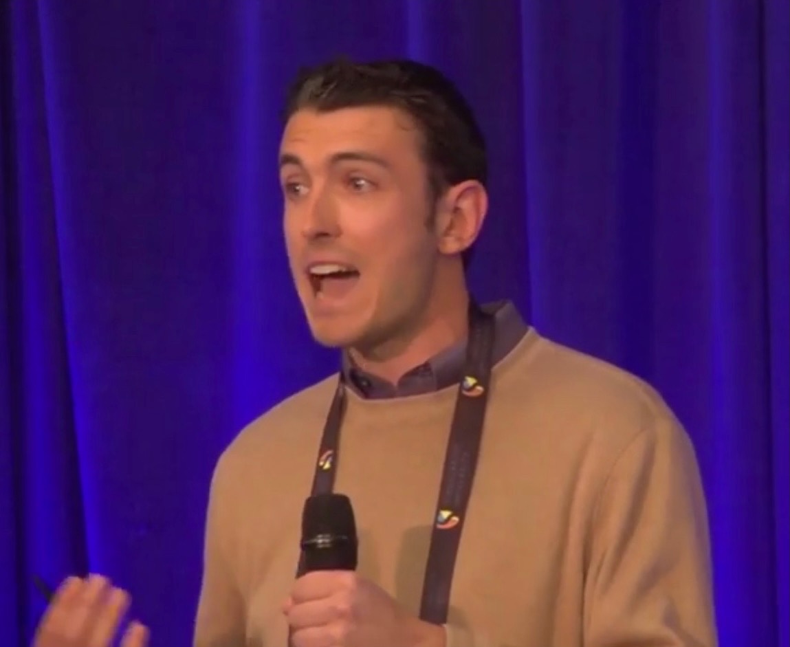 Brinkley Warren speaking on stage — photo 9