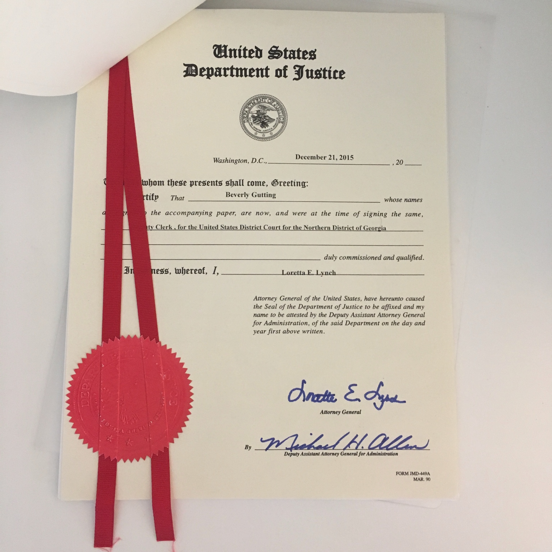 U.S. Department of Justice certification — signed Loretta E. Lynch, Attorney General, December 21, 2015.