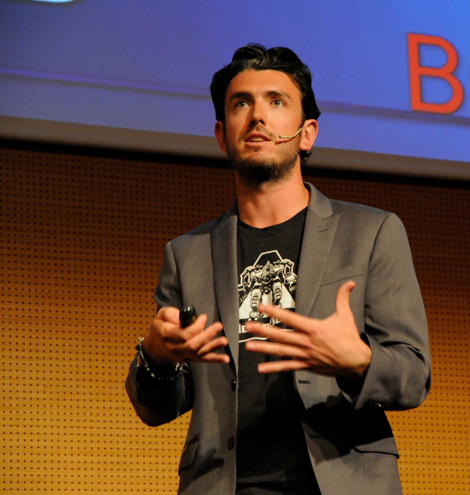 Brinkley Warren speaking on stage — photo 10