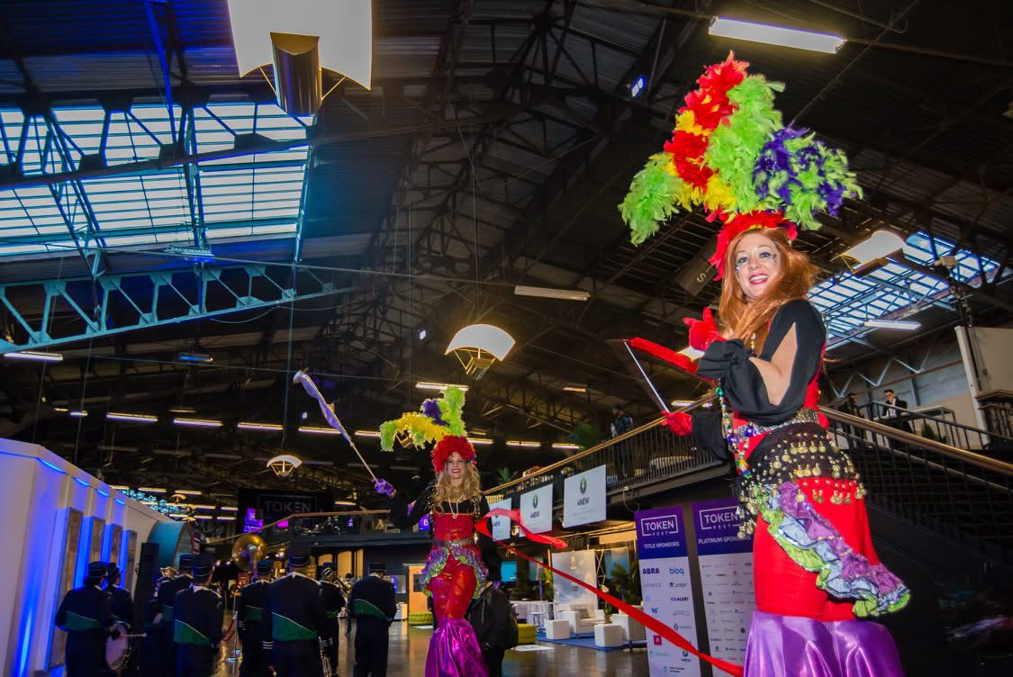 Stilt walkers on the show floor.