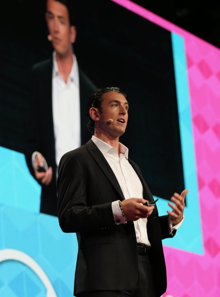 Brinkley Warren speaking on stage — photo 5