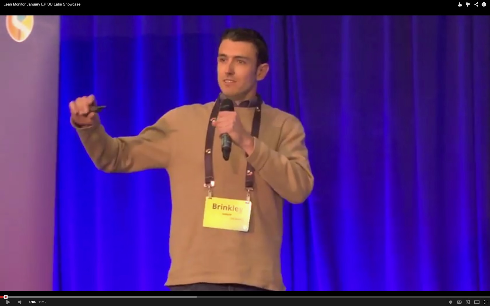 Brinkley Warren speaking on stage — photo 12