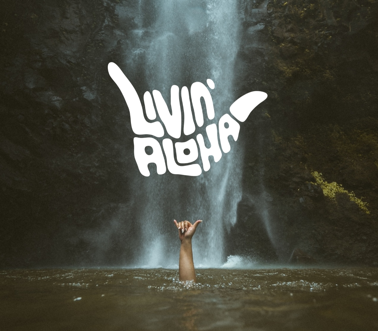 Livin' Aloha — shaka beneath the falls.
